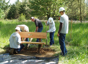 Wolf Creek Job Corp, Ray Jensen and John Malone installing new bench on Nature Trail
